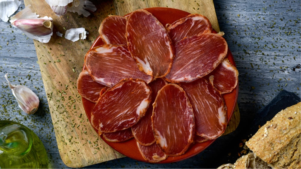 sliced lomo iberico with oil