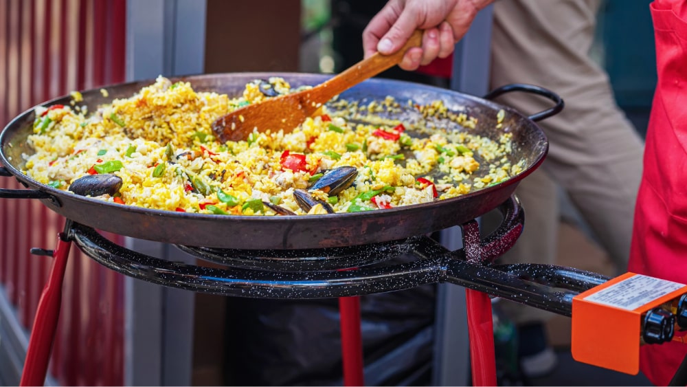 cooking a paella on a paella burner