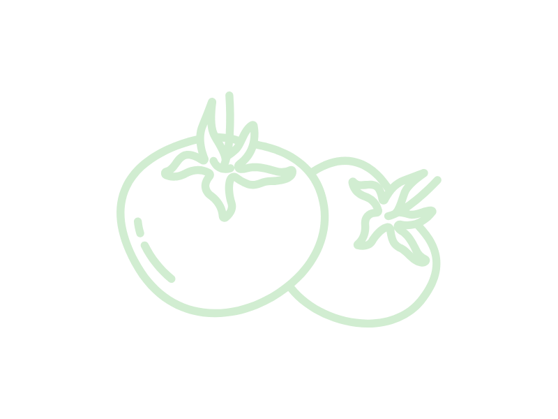 Two green tomatoes with leaves on a white background