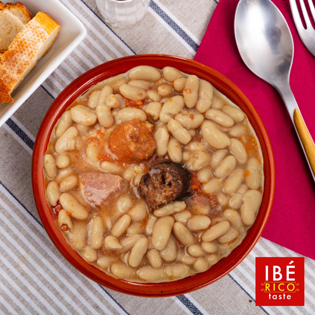 white beans with chorizo on a plate with bread