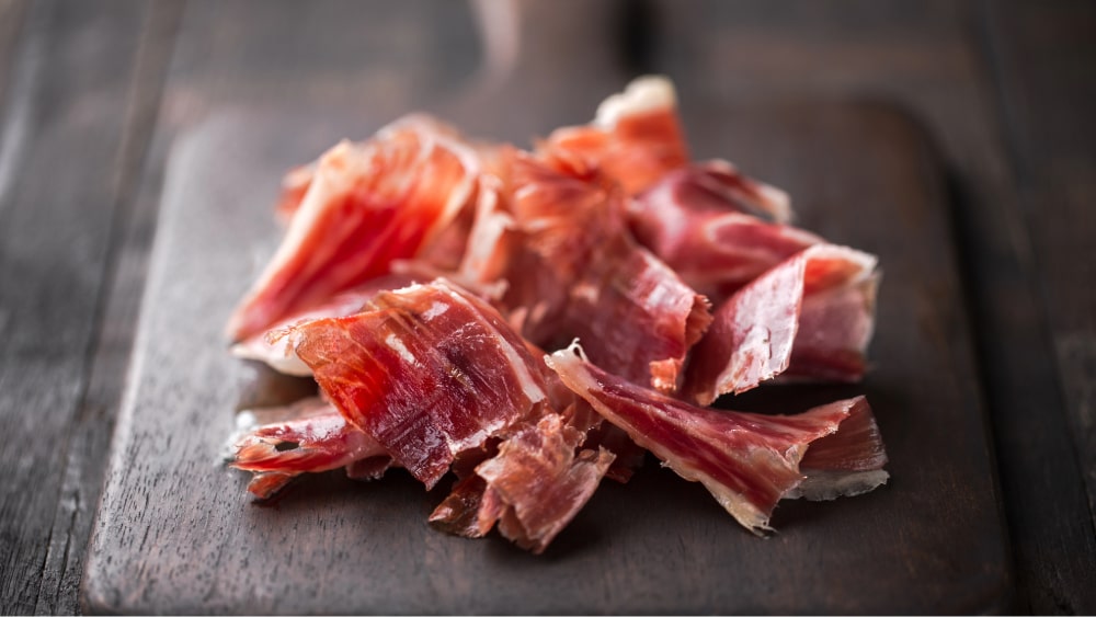slices of jamon iberico on a table