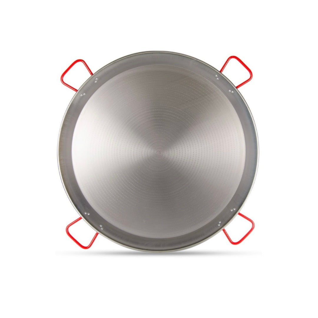 Paella pan with red handles on a white background