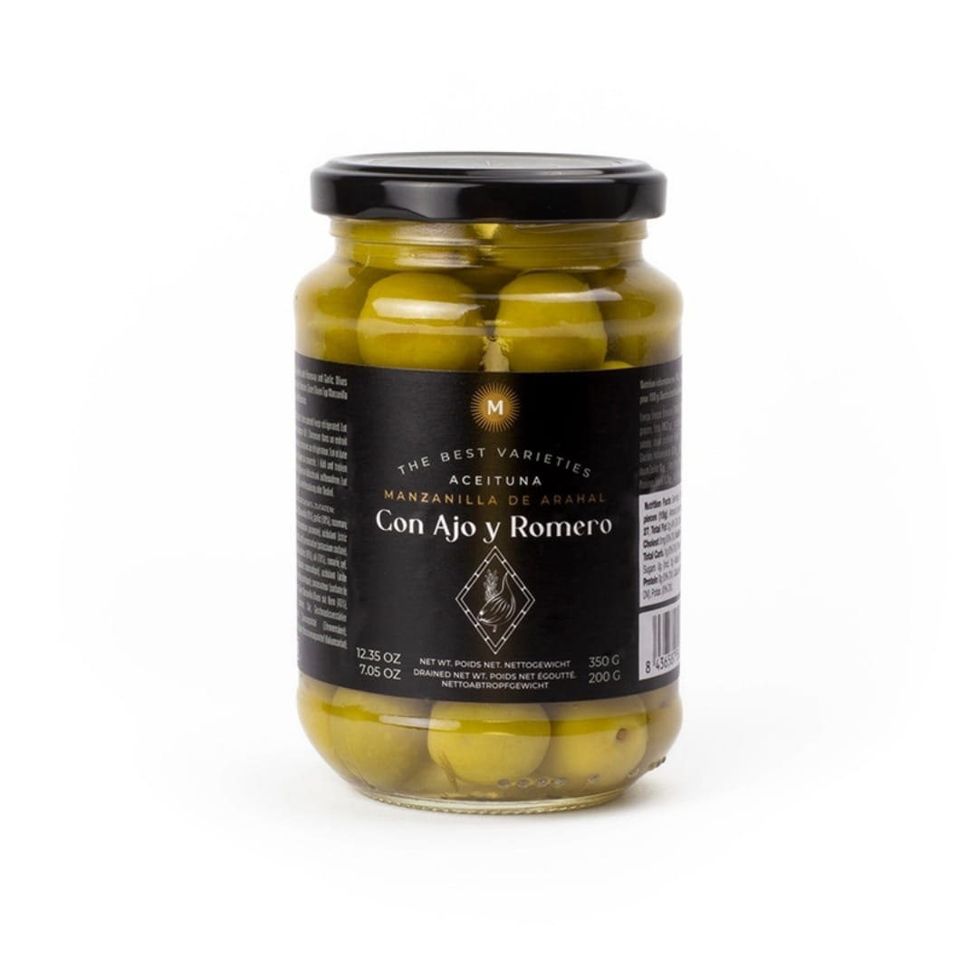 A glass jar of Con Ajo y Romero pickled green olives with a black lid and a black label, set against a plain white background.