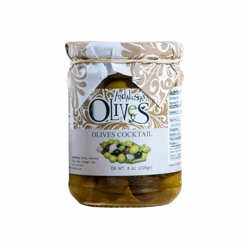 a glass jar with a label green and white with olives inside