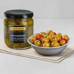 Jar of La Española olives and a bowl of pickled olives on a light gray background
