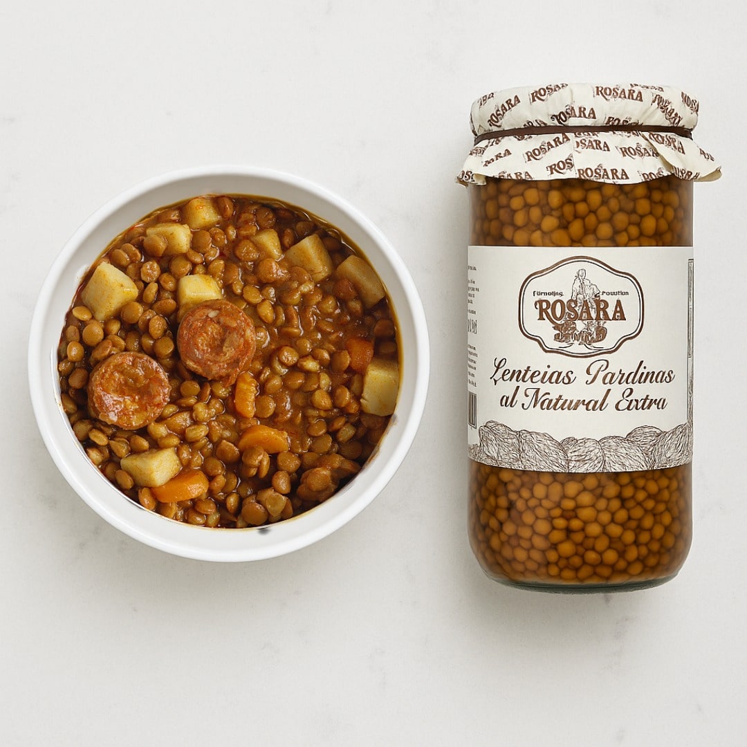 Jar of Rosara lentils next to a bowl of lentil soup on a white background