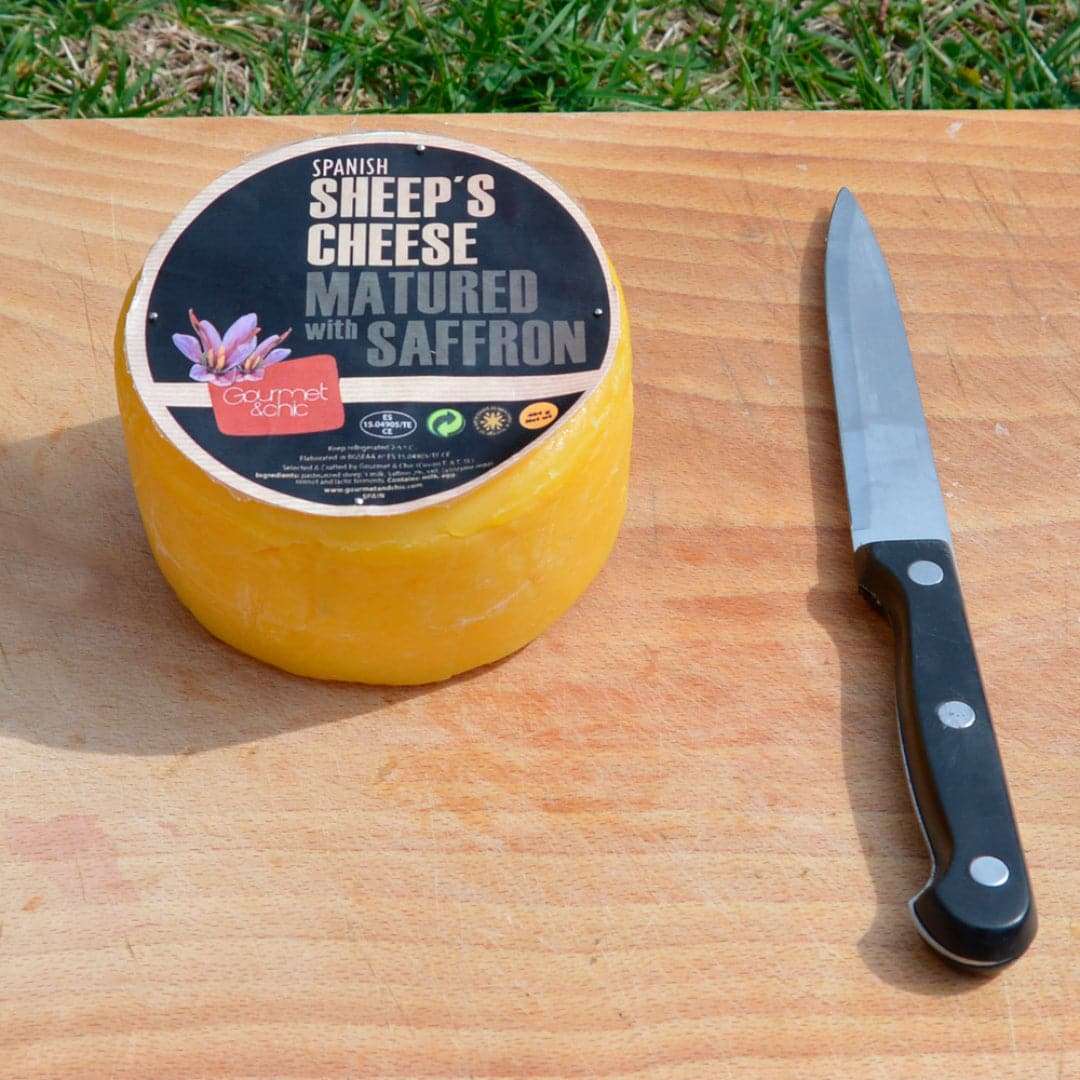 Sheep’s cheese with saffron and a knife