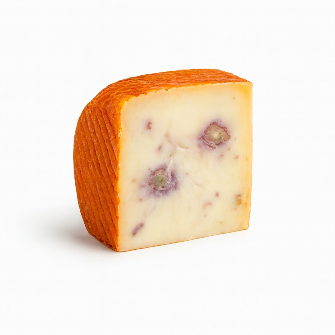 Block of cheese with a textured rind on a white background