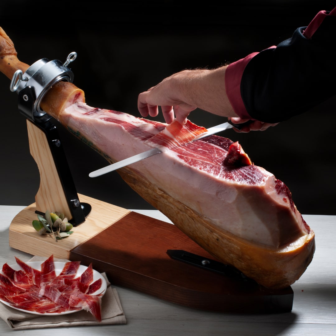 slicing a Spanish ham leg