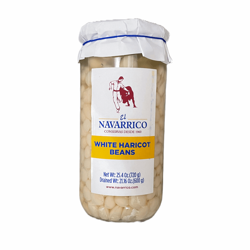 a glass jar with a white label with small white beans inside